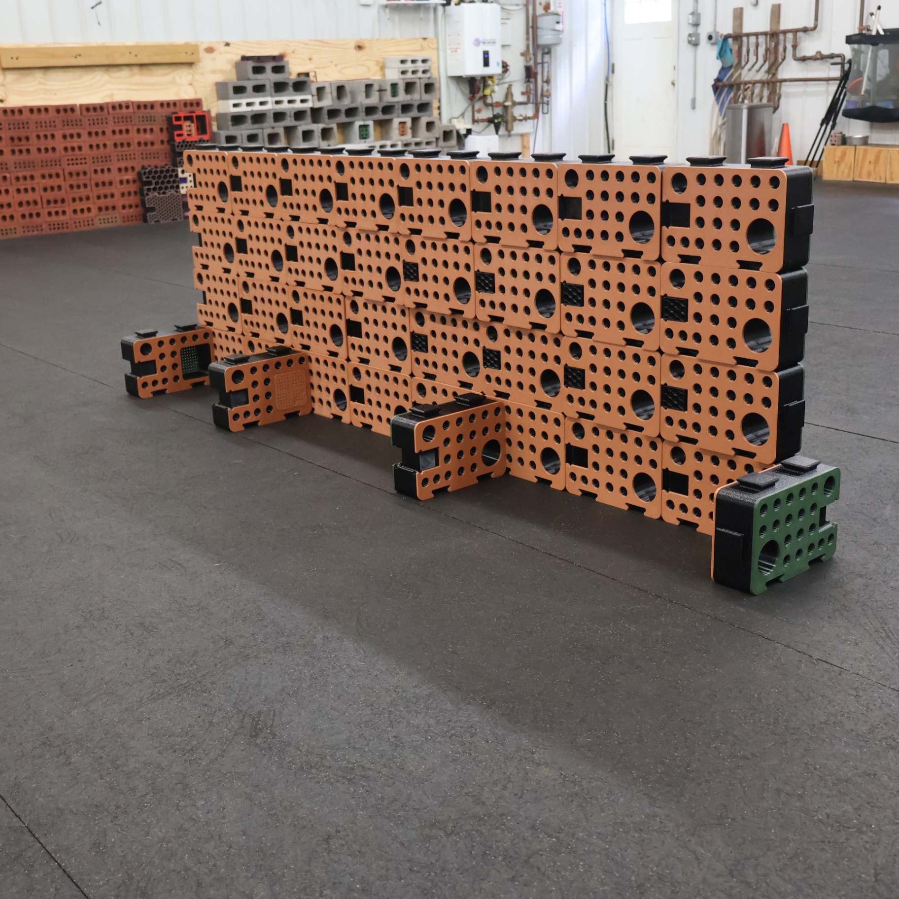 Angled view of an orange D-Block wall with side blocks forming search pockets